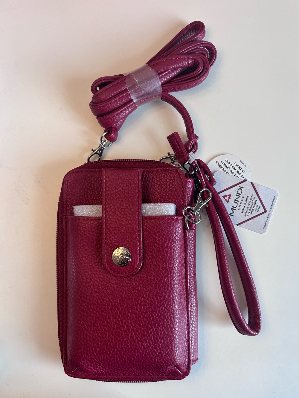 mundi Pebbled Crossbody Phone Wallet in Berry